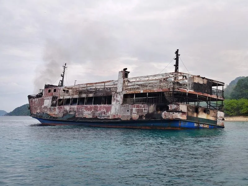 Five people died and 87 are missing following a fire on a passenger ferry