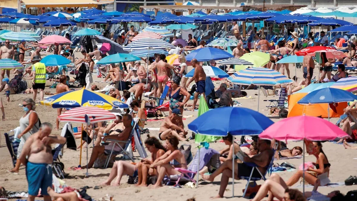 Spaniards struggle to enjoy their own beaches in tourist deluge