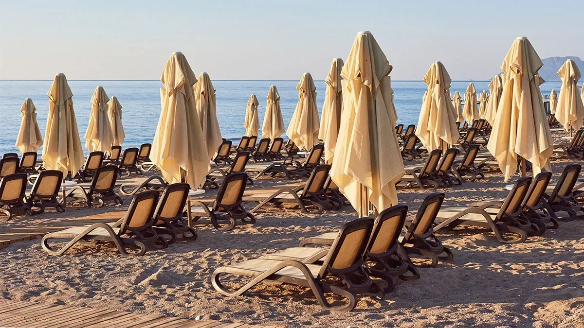 Anti-tourism protestors destroy hundreds of sunbeds in Tenerife